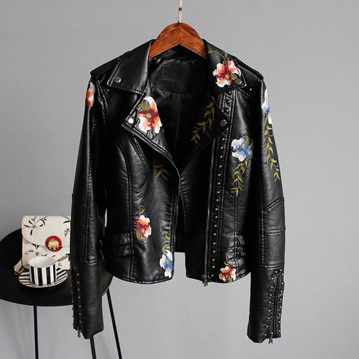 Women's embroidered floral biker jacket, faux leather, chic outerwear, statement fashion piece.