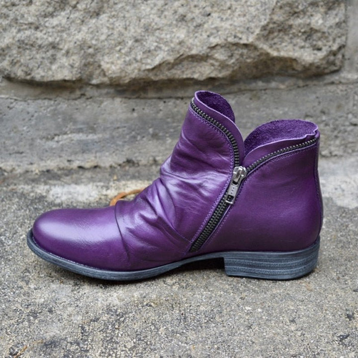 Close-up of women's leather ankle boots, highlighting the quality material and fall fashion appeal.
