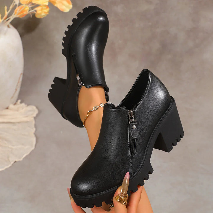 Women's leather block heel dress shoes paired with a fashionable outfit