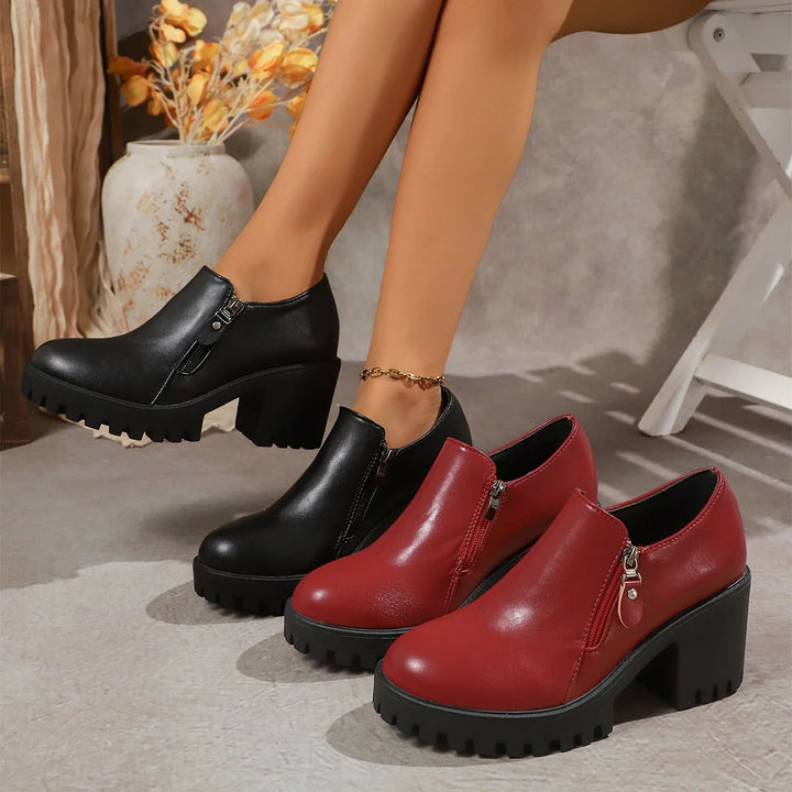 Detail of the premium leather texture on women's block heel dress shoes