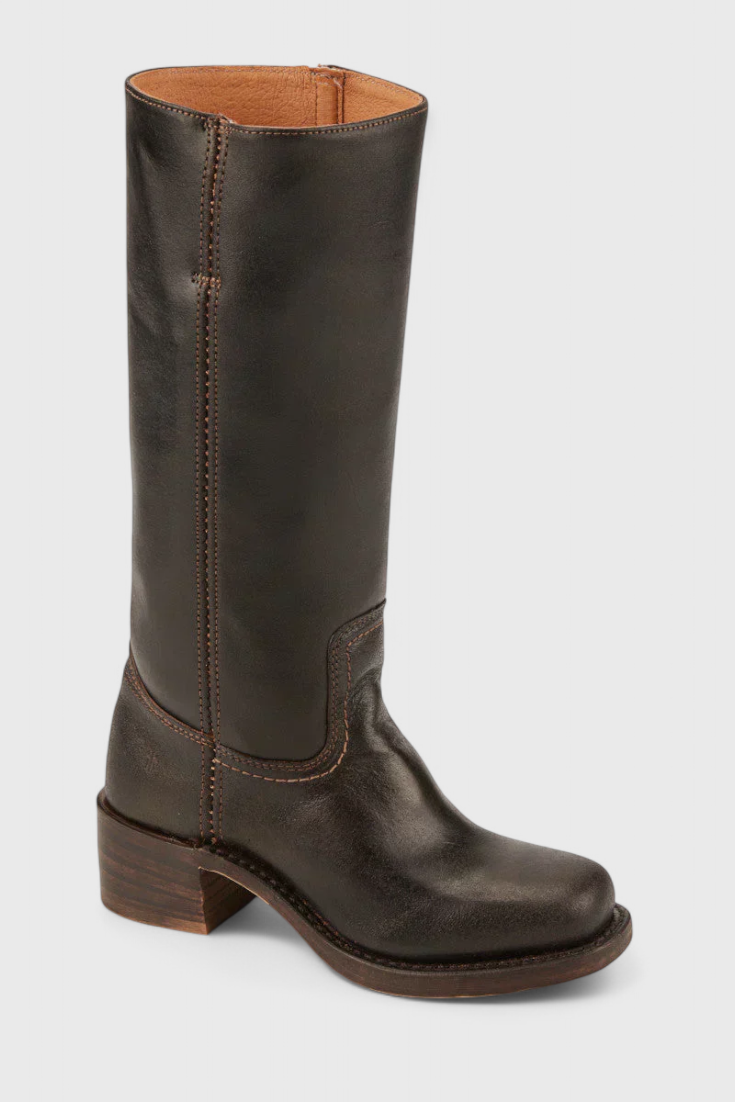 Women's knee-high leather boots with an ankle buckle detail, adding a touch of style.