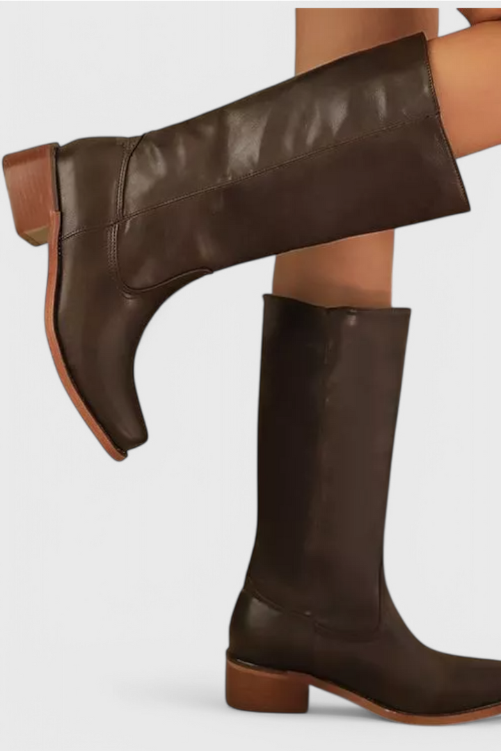 Stylish women's knee-high heeled boots in genuine leather, perfect for formal or casual wear.