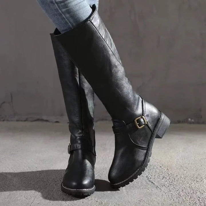 Women's black leather orthopedic ankle boots, comfortable and stylish for winter. Features block heel.