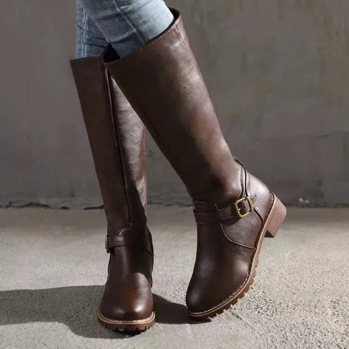 Stylish women's orthopedic leather boots in a rich tan color, designed for comfort and durability.