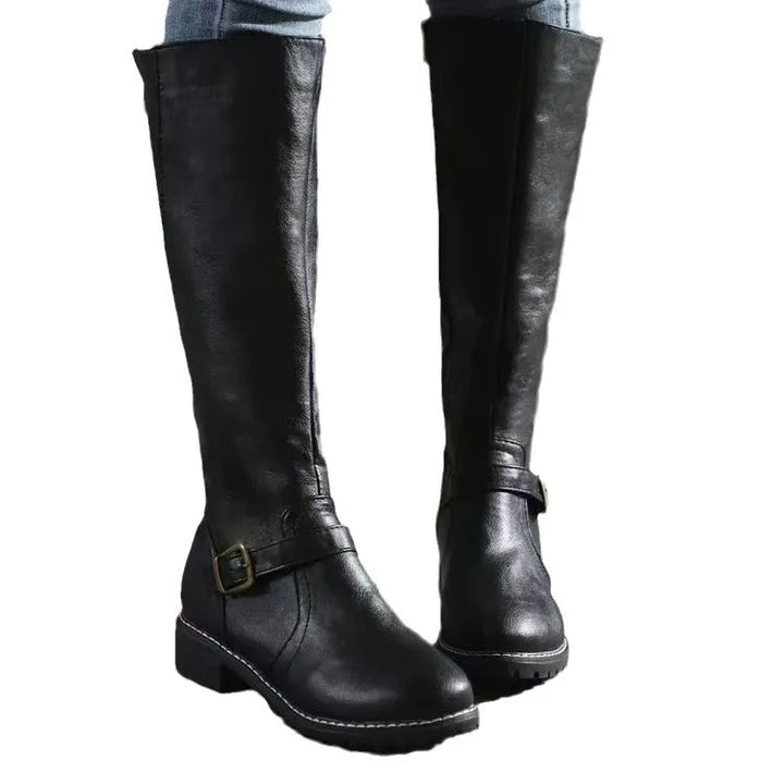 Pair of women's comfortable orthopedic winter boots made from genuine leather with a low block heel.