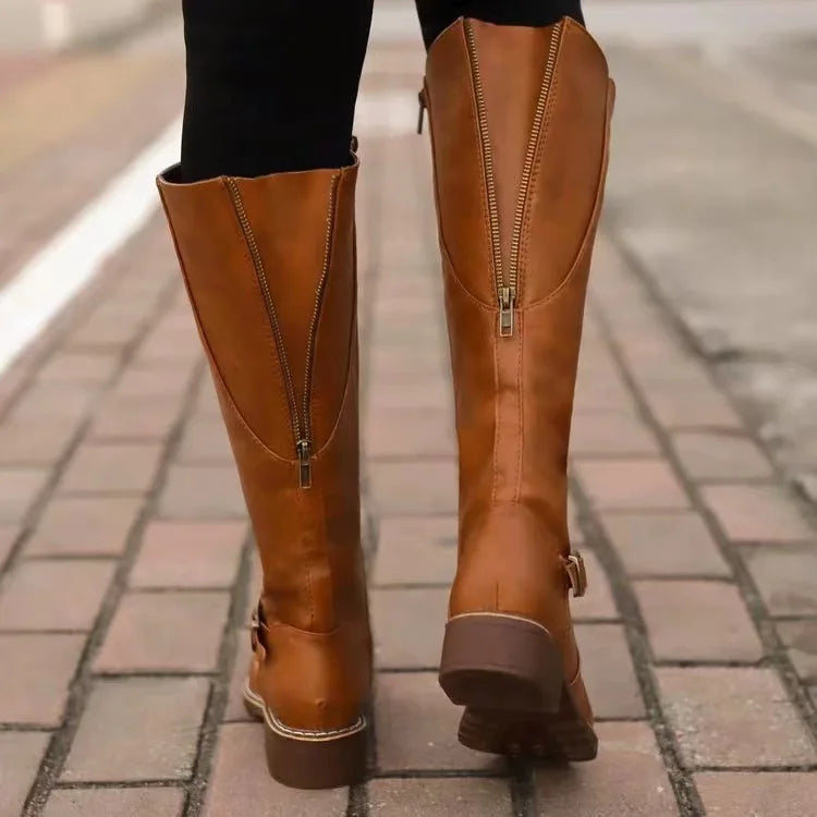 Fashionable women's orthopedic leather boots, versatile design suitable for various winter outfits.