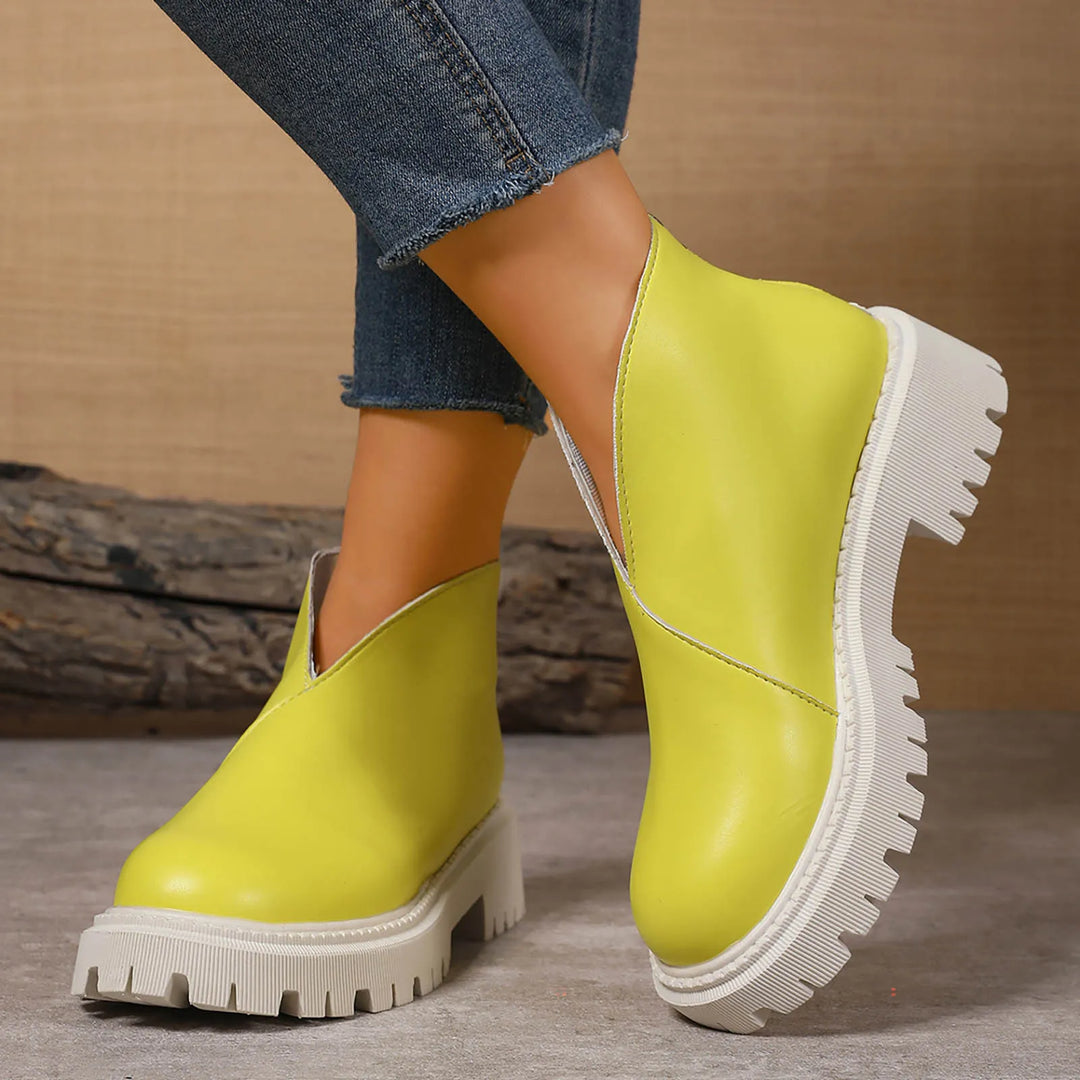 Contemporary women's leather slip-on platform shoes, essential casual footwear accessory.
