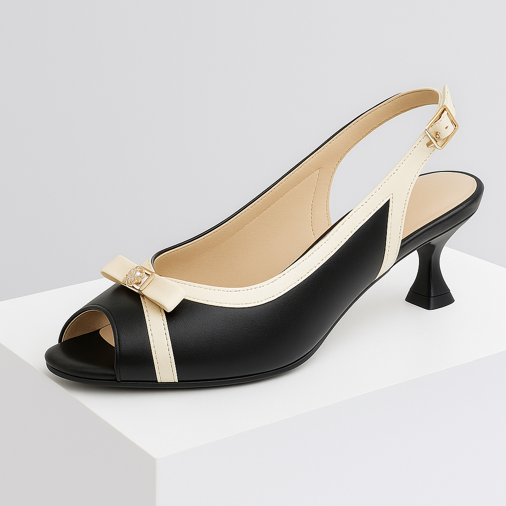 Close-up of the delicate bow detail on a women's leather slingback heel, showcasing elegant design.