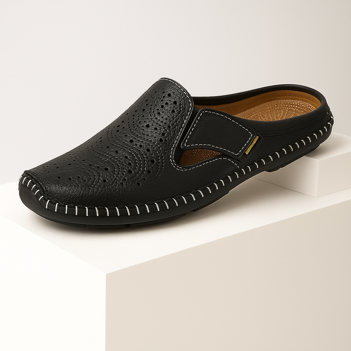 Close-up of a women's leather slip-on mule, highlighting the high-quality leather and perforated texture.