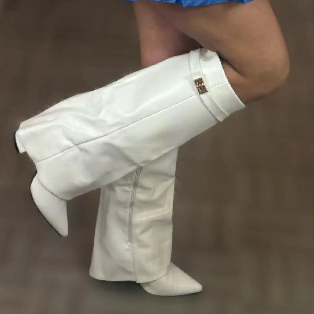Close-up of the buckle detail on women's black leather thigh-high boots