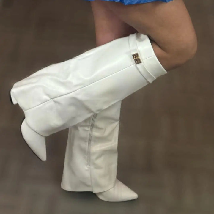 Close-up of the buckle detail on women's black leather thigh-high boots