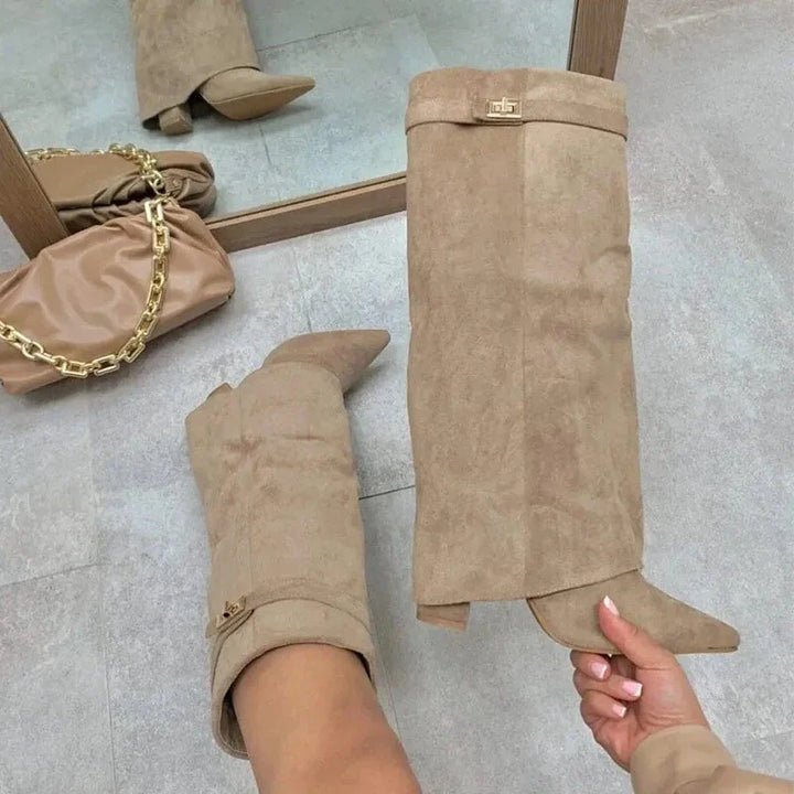 Full-length view of women's tall leather boots with buckle, suitable for elegant wear