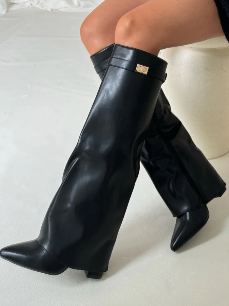 Back view of women's tall leather boots with buckle straps, emphasizing craftsmanship and style.
