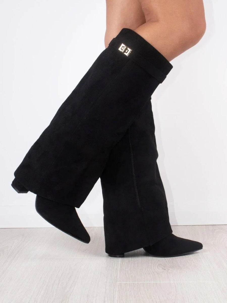 Front view of women's luxurious leather thigh-high boots, showcasing buckle embellishments.
