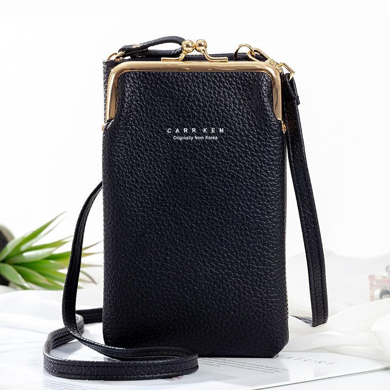 Women's versatile black phone crossbody bag, worn over the shoulder to demonstrate adjustable strap length