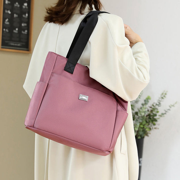 Women's black multi-pocket waterproof nylon shoulder bag, great for travel & daily use