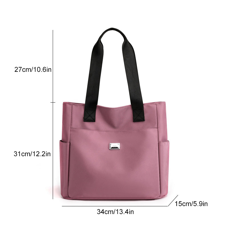 Model wearing a women's multi-pocket waterproof nylon shoulder bag, showcasing its size