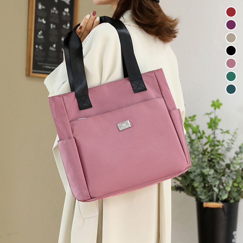 Front angle of the women's waterproof nylon shoulder bag, emphasizing its clean, functional design