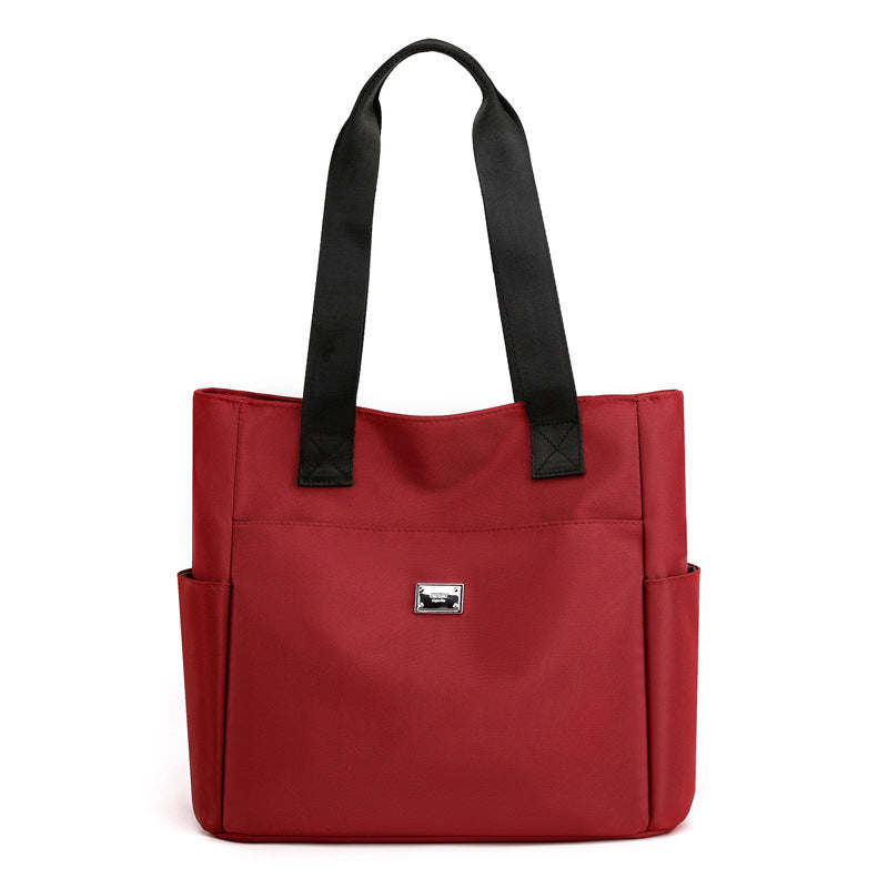 Overhead shot of the women's waterproof nylon shoulder bag, demonstrating its spacious interior