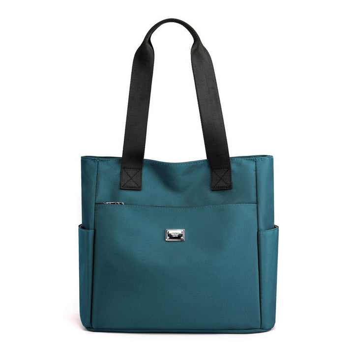 Women's waterproof shoulder bag in durable nylon, featuring sturdy zippers and hardware