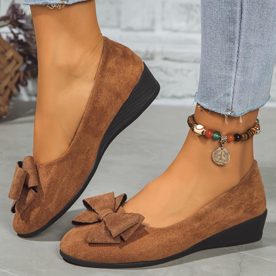 Black stylish orthopedic flats for women, low heel, arch support comfort.