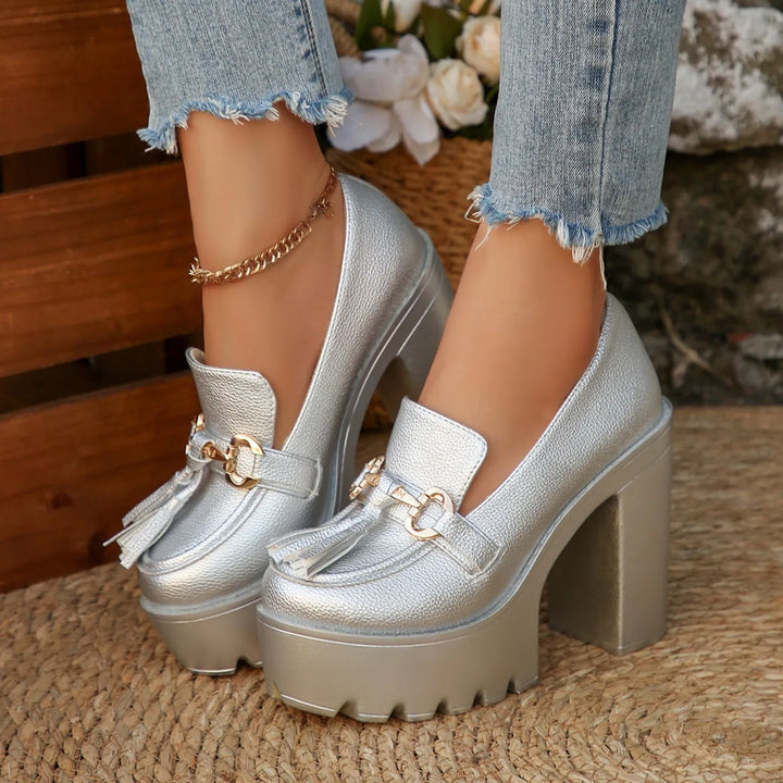 Stylish women's platform loafers with tassel detail, perfect for adding height and comfort.