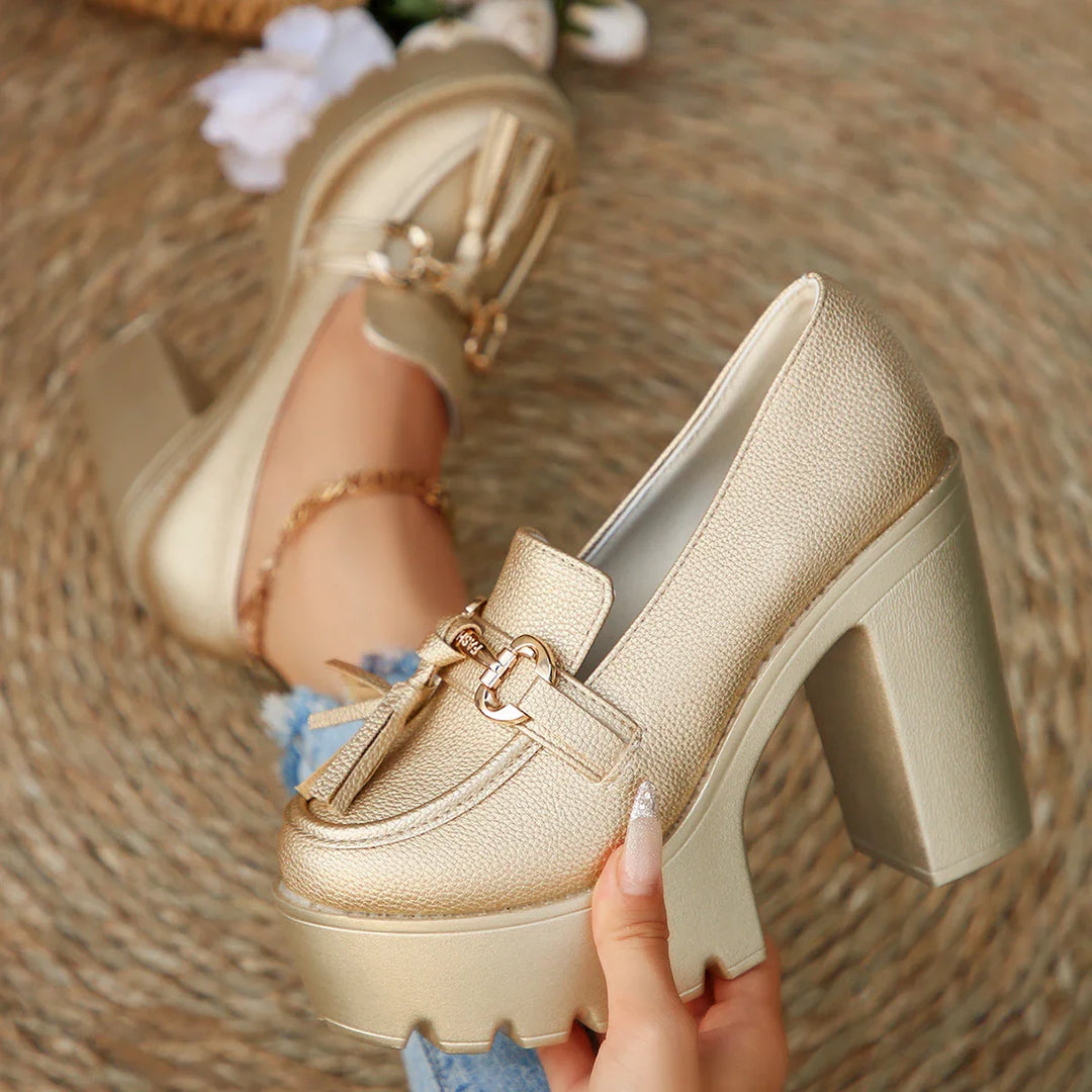 Detail shot of the tassel and stitching on a women's platform loafer, highlighting craftsmanship.