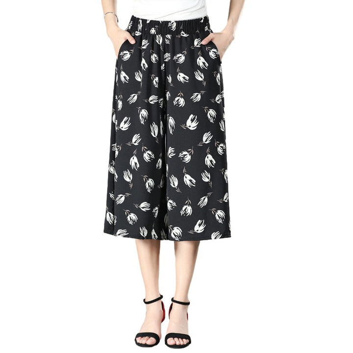 Black high waisted pleated culottes for women, wide leg silhouette, a staple for casual outfits.