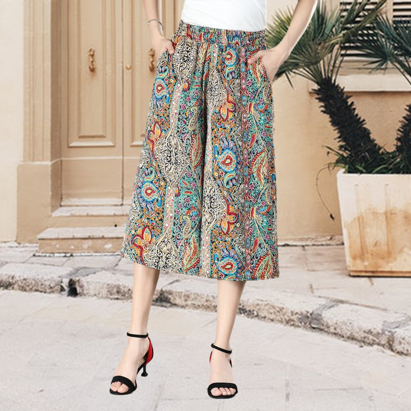 Women's pleated wide leg pants, high waist, floral print chiffon, perfect for a relaxed summer look.