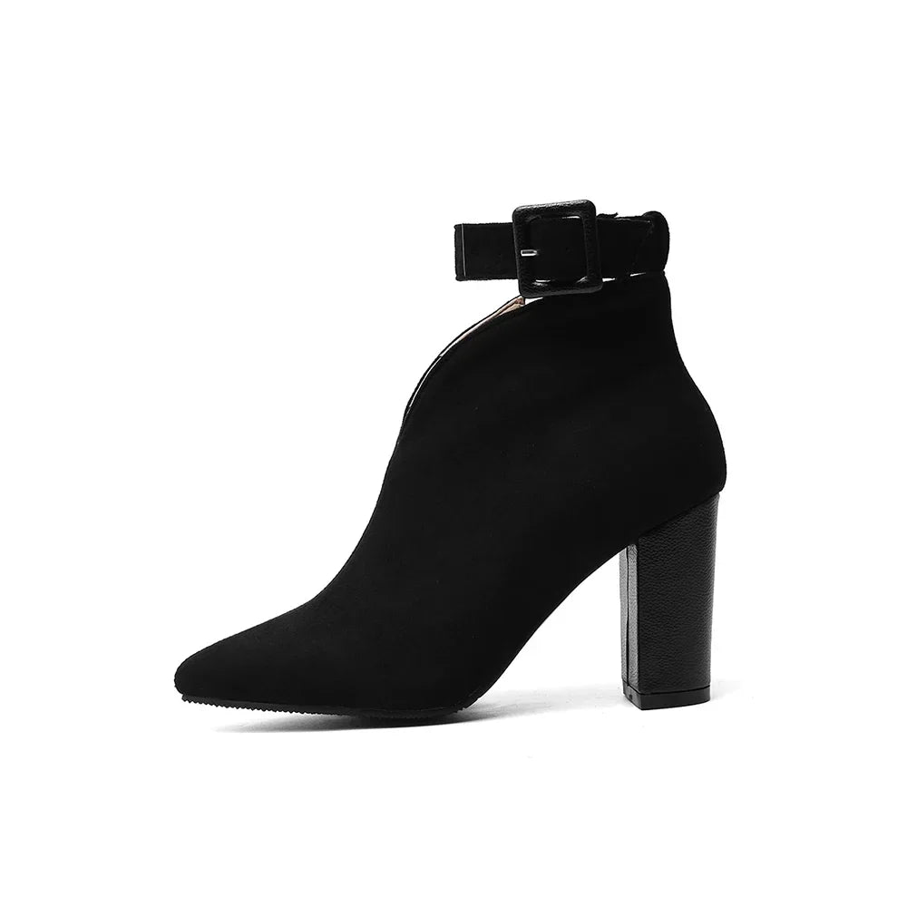 Elegant women's pointed toe ankle boots with a sophisticated buckle design in black
