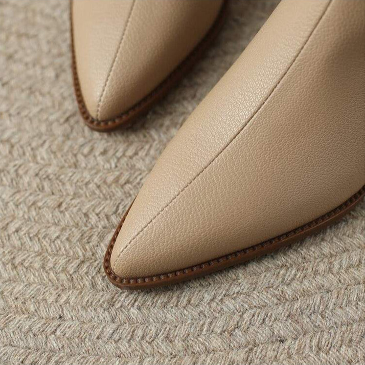 Easy slip-on women's pointed toe ankle boots with comfortable low heel.