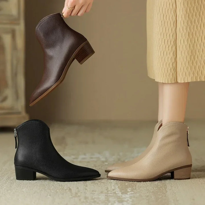 Women's stylish pointed toe slip-on ankle boots with a comfortable low heel.