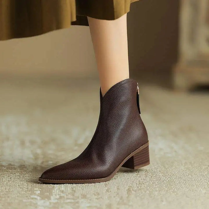 Stylish slip-on women's ankle boots, pointed toe design, comfortable low heel.