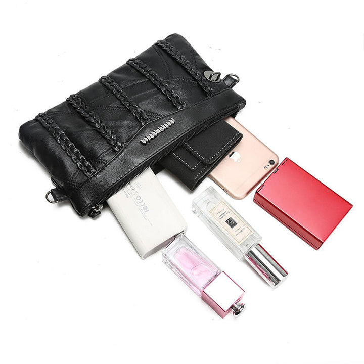 Chic women's PU leather crossbody clutch with a spacious interior and magnetic snap closure, great for organization.