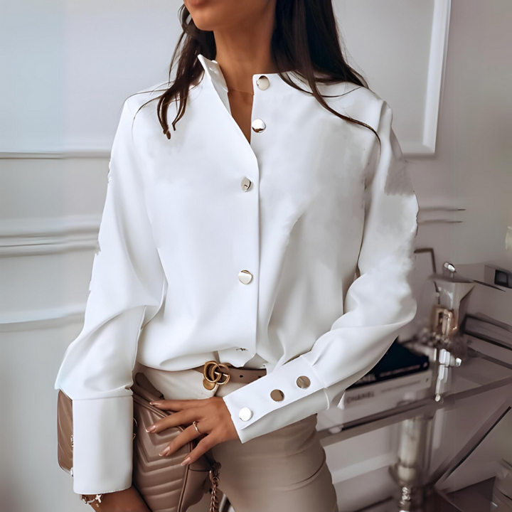 Textured quilted button-down shirt for women. Comfortable casual long-sleeve top, ideal for layering.