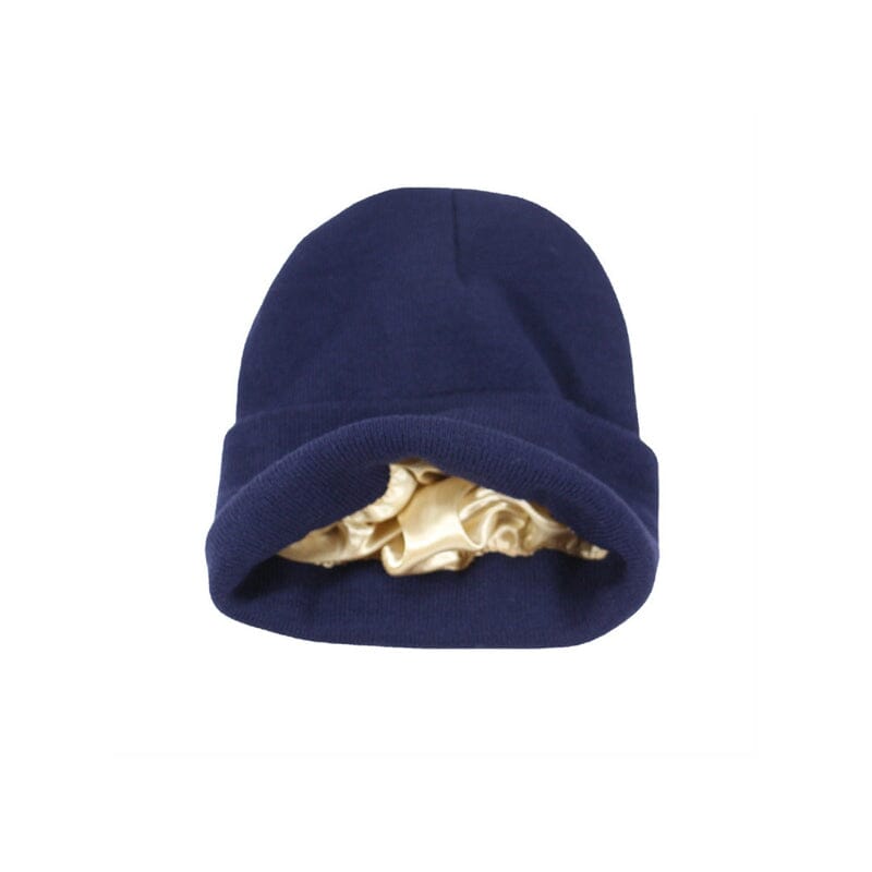 Model wearing a white satin-lined winter beanie, demonstrating its comfort and style