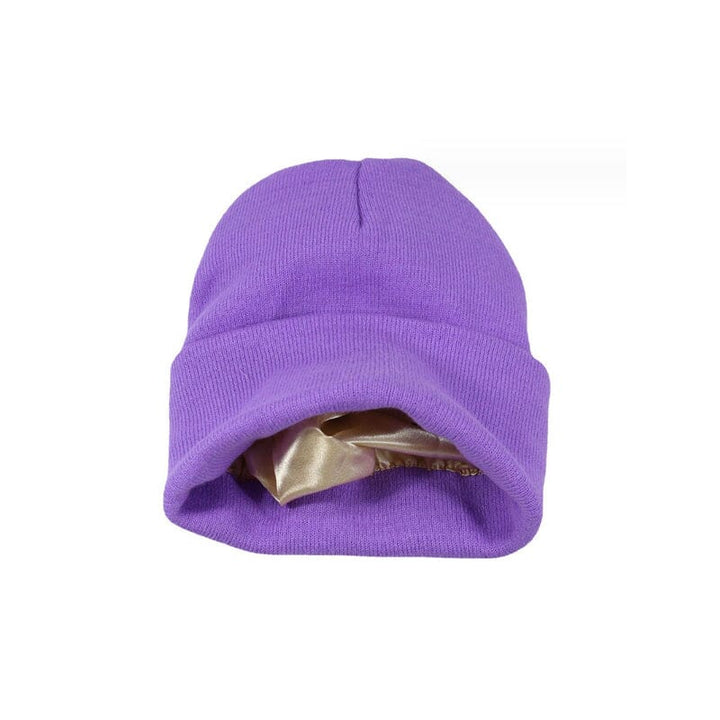 Women's knitted beanie in a vibrant red, featuring a protective satin lining, anti-frizz