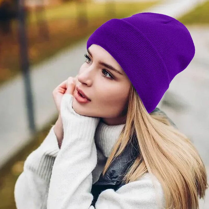 Women's satin-lined beanie in a rich emerald green, a hair protective winter hat