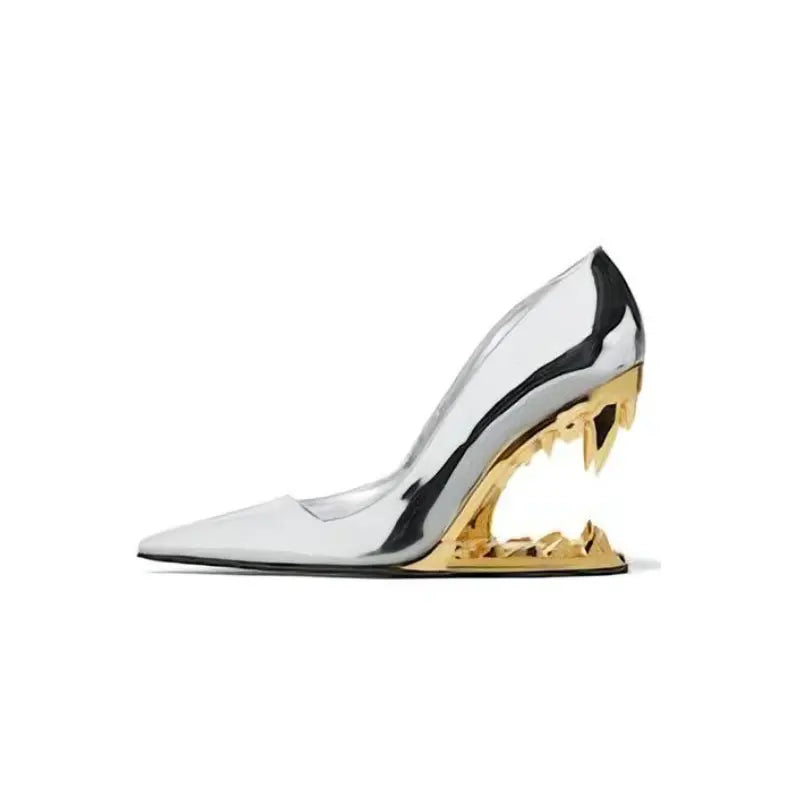Detailed shot of the sharp, metallic fang heel on stylish women's party pumps.
