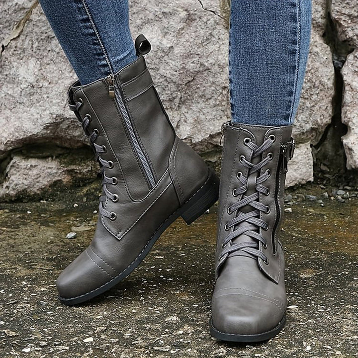 Fashion-forward women's combat boots, showcasing the popular side-zip trend