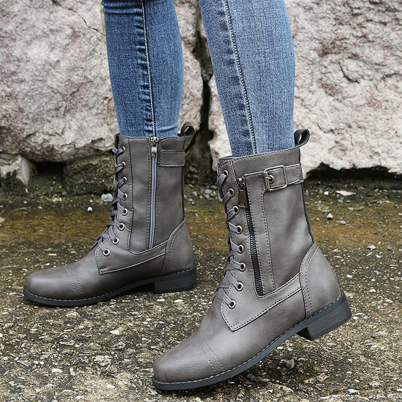 Fashionable women's ankle combat boots with side-zip detail, black color