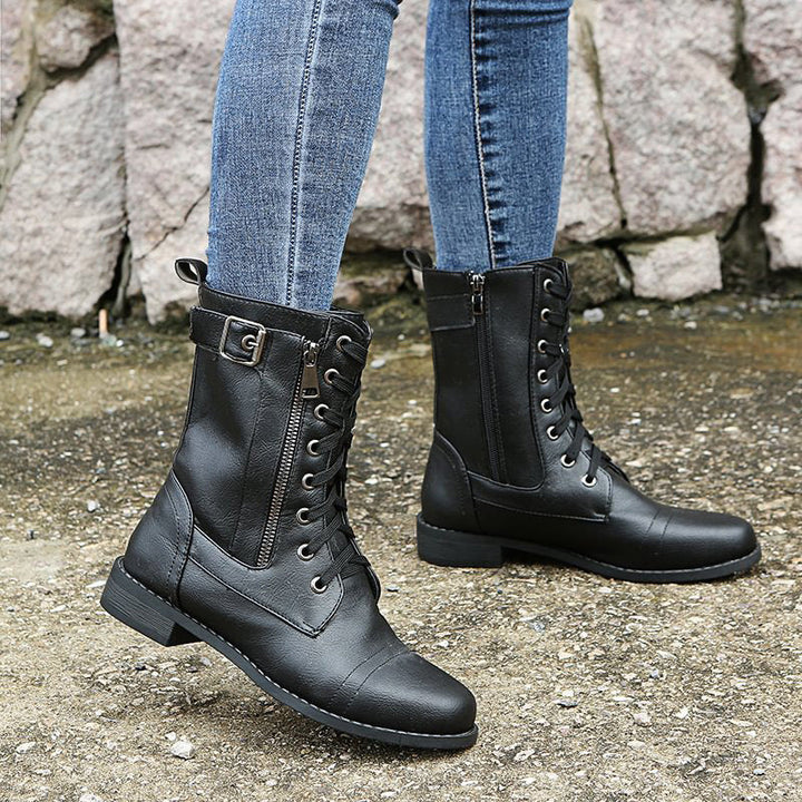 Rugged women's combat boots, featuring a convenient side-zip for easy wear