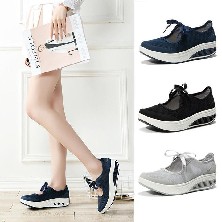 Women's black slip-on platform wedge sneakers with breathable mesh upper, comfy round toe