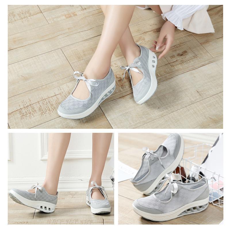 Back view of women's black slip-on platform wedge sneakers, stable and stylish casual shoes