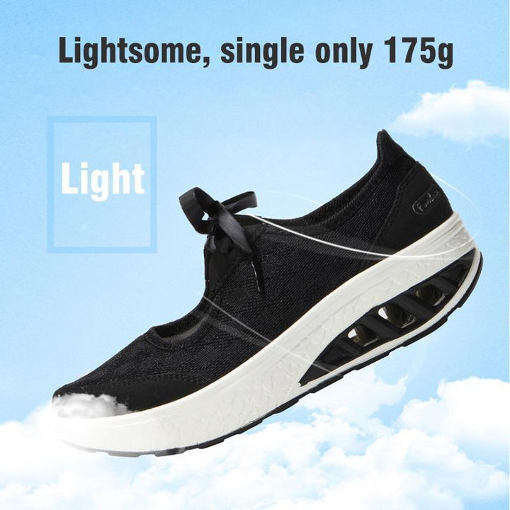 Front view of women's grey mesh slip-on platform wedge sneakers, comfortable travel shoes