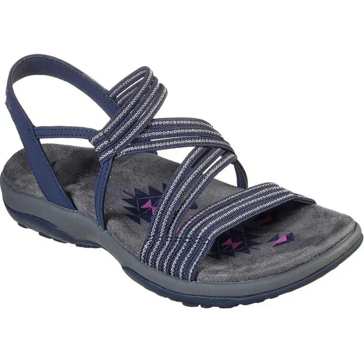 Close-up of a women's brown strappy comfort sandal showing ergonomic footbed and durable outdoor sole.