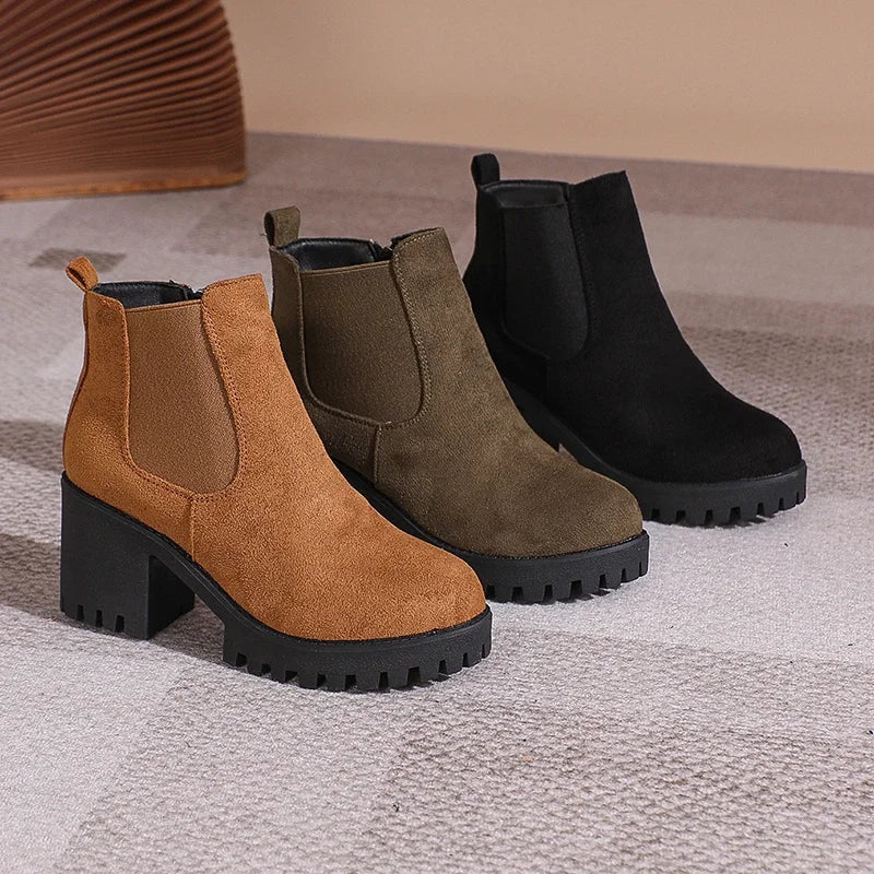 Women's versatile tan suede ankle boots with a durable block heel, essential for fall fashion