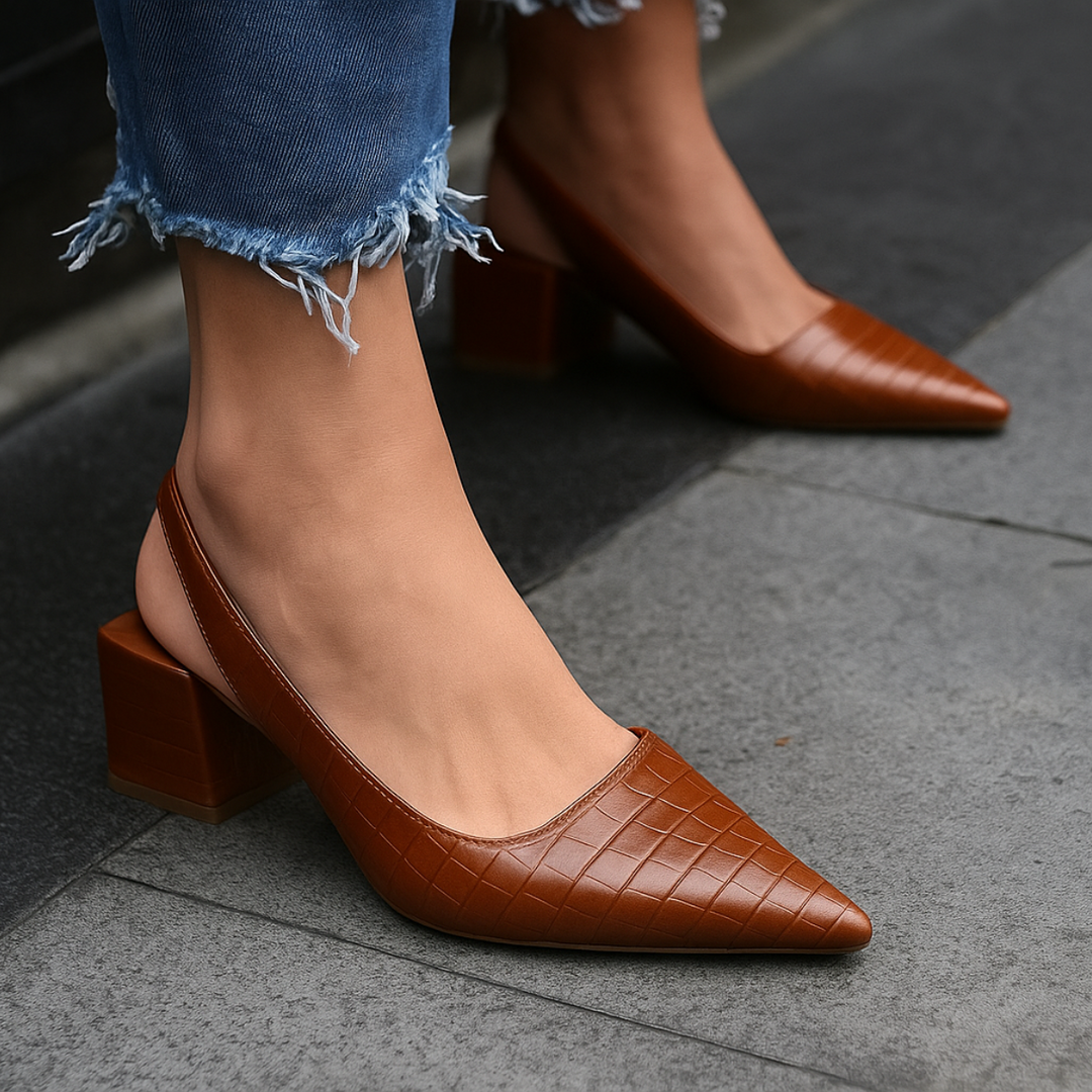Stylish brown women's loafers with supportive heels, ideal for comfortable professional footwear.