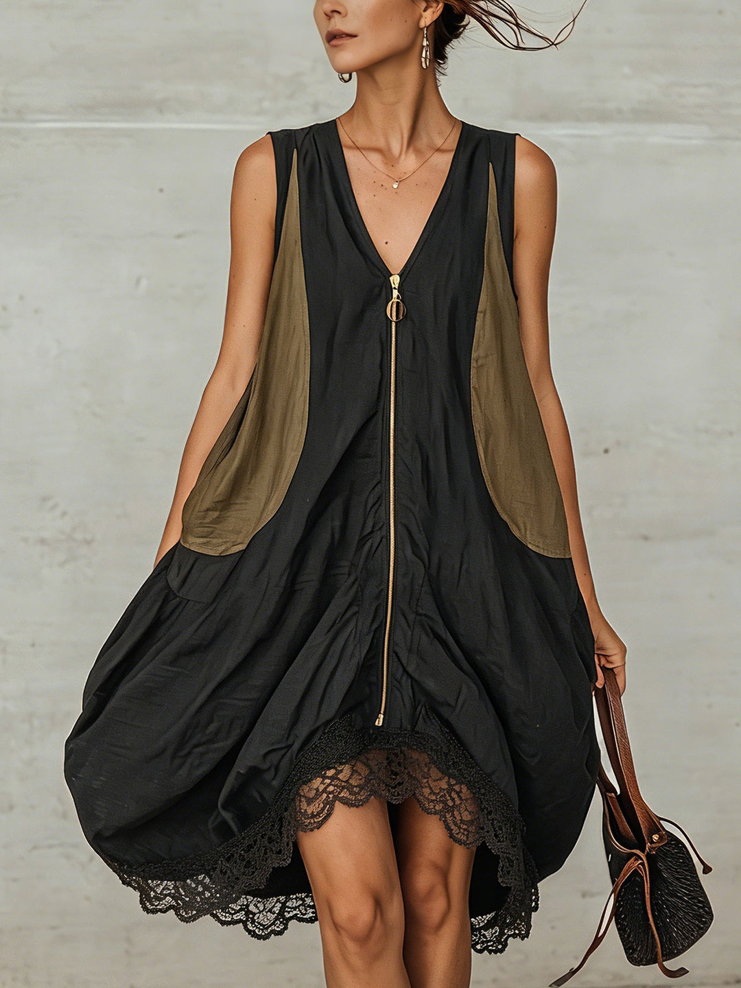 Women's black V-neck zip-front midi dress with delicate lace hem, perfect for casual or elegant occasions.