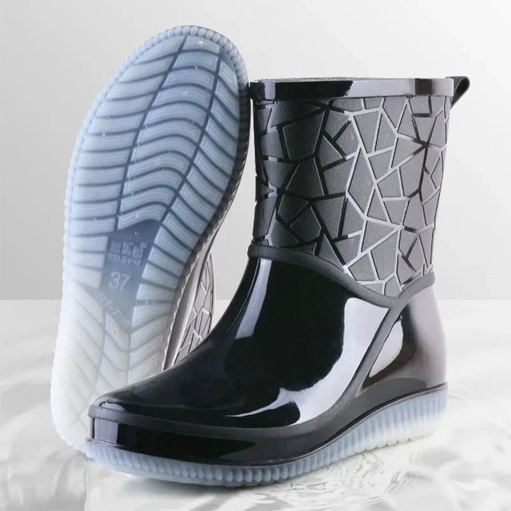 Women's black waterproof winter rain boots, slip-resistant sole, side view